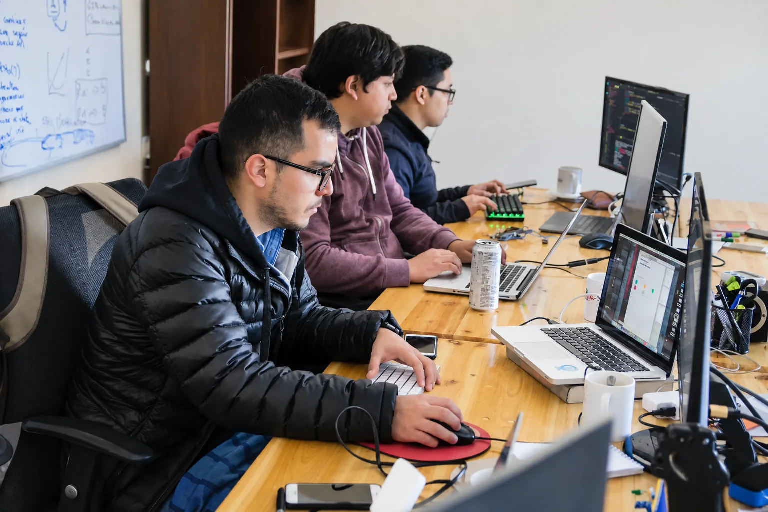IT support team working together at a computer